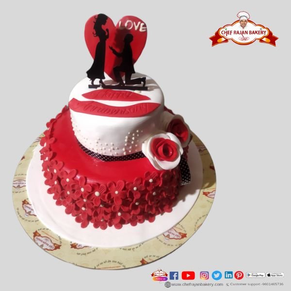 Engagement ring and container . Red and white heart cake made for engagement  Stock Photo - Alamy